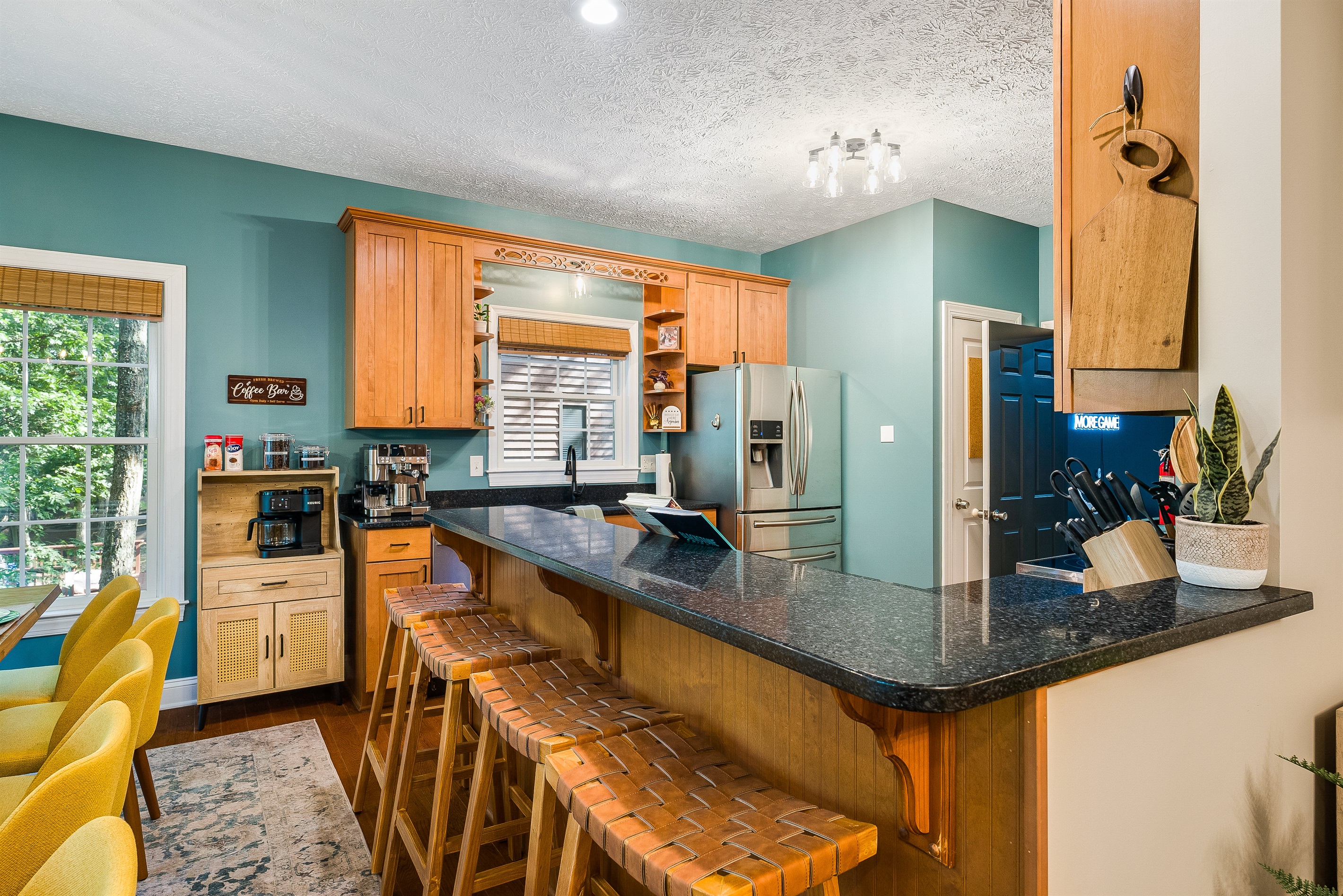 Pull up a seat at the breakfast bar — perfect for morning coffee, late-night snacks, or chatting while the chef of the group works their magic.