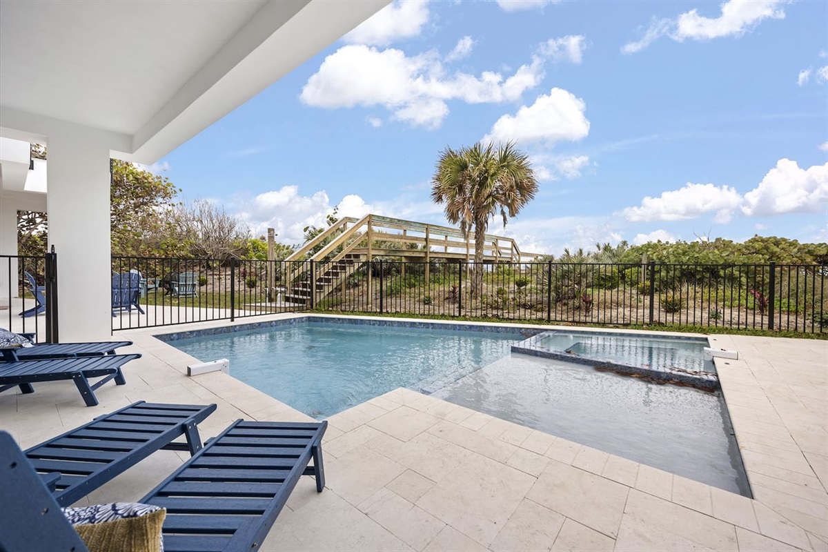 Relax by the sparkling swimming pool, with comfortable lounge chairs perfect for unwinding. Surrounded by lush greenery, this serene outdoor space offers a peaceful retreat for ultimate relaxation