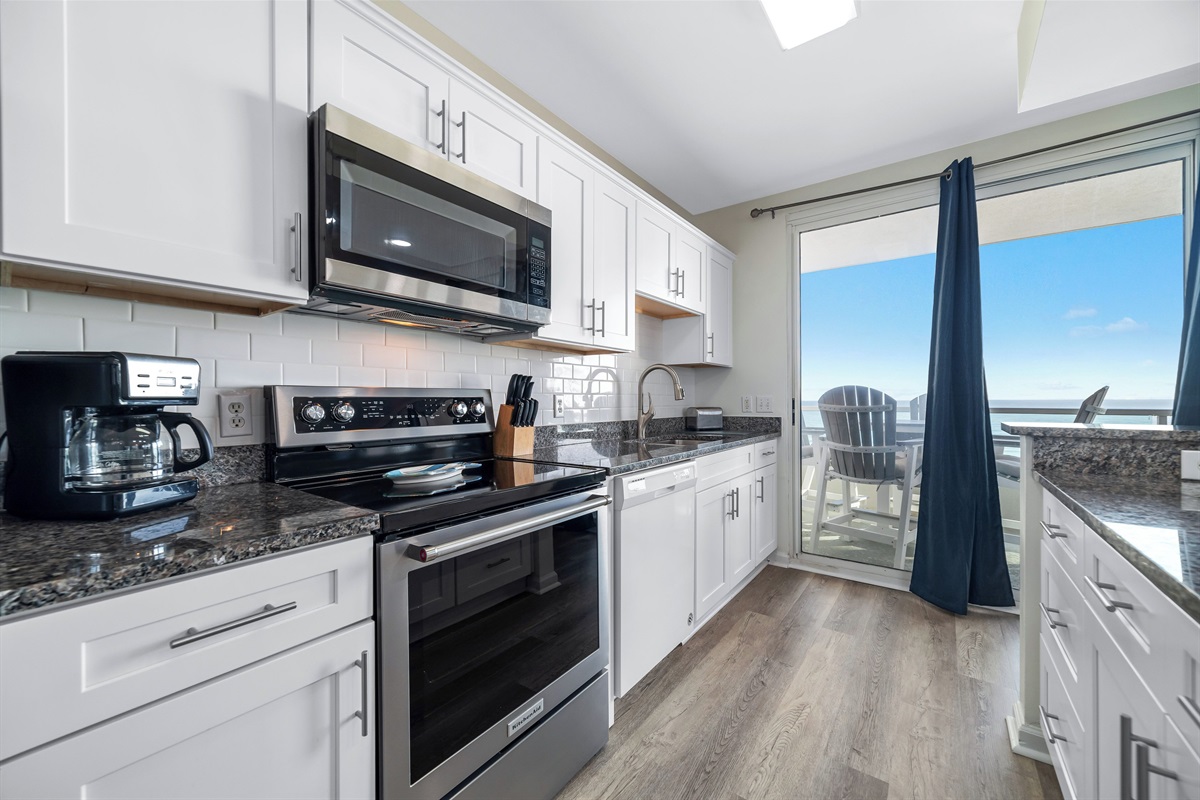 Beautiful stocked kitchen with Stainless appliances, granite tops and tiled backsplash! 