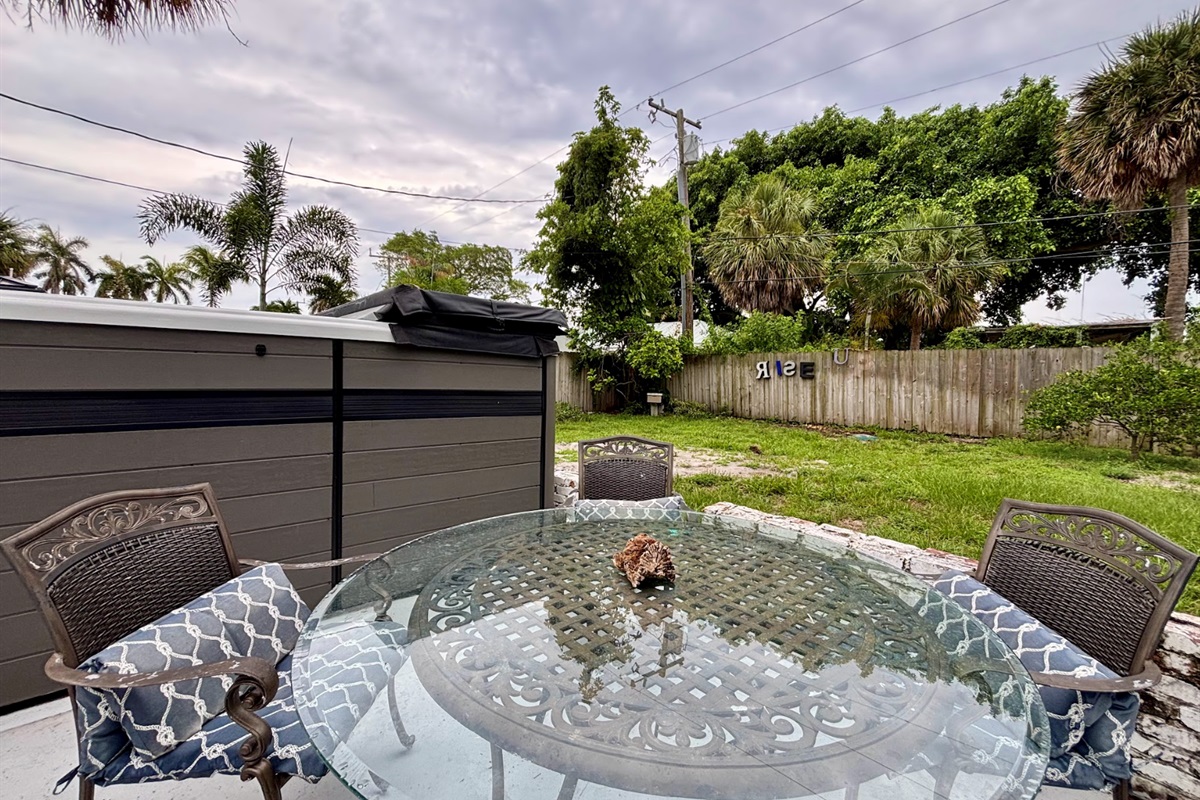 Enjoy the patio as you take in the tropical scenery next to the swim spa.