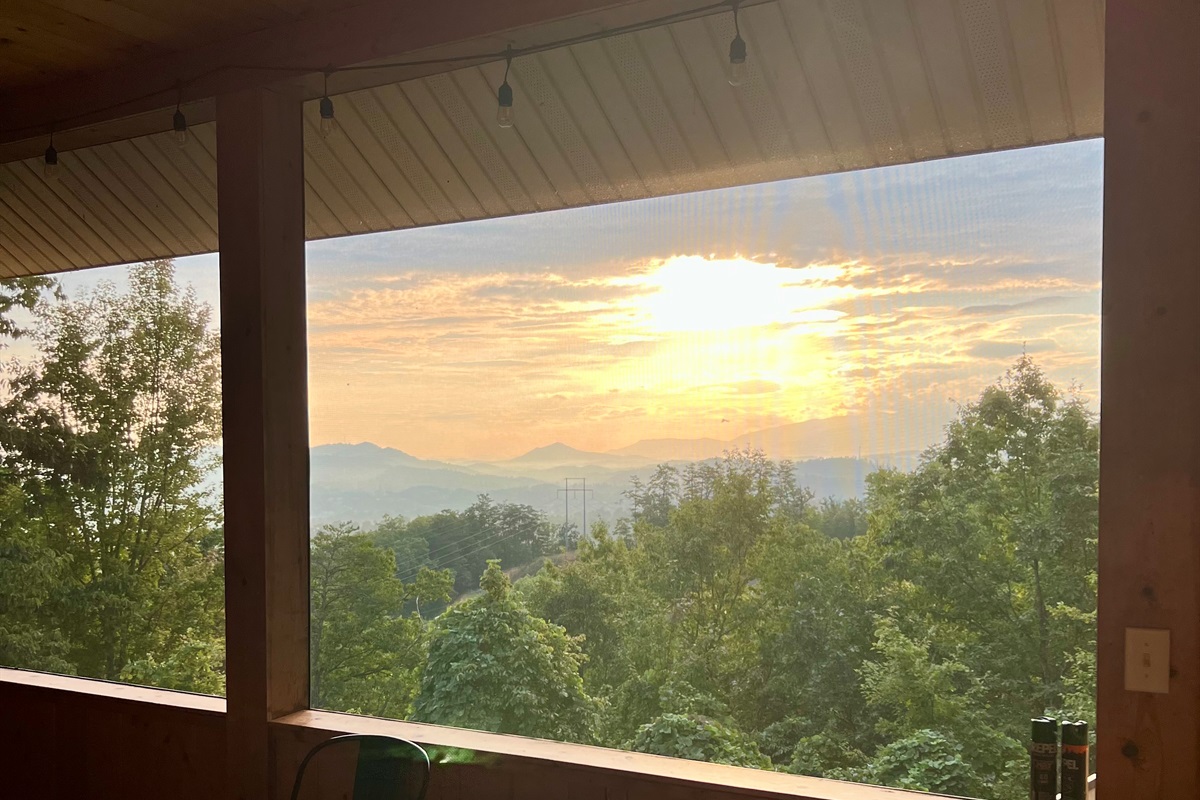Enjoy gorgeous sunrises and sunsets from the screened- in porch area
