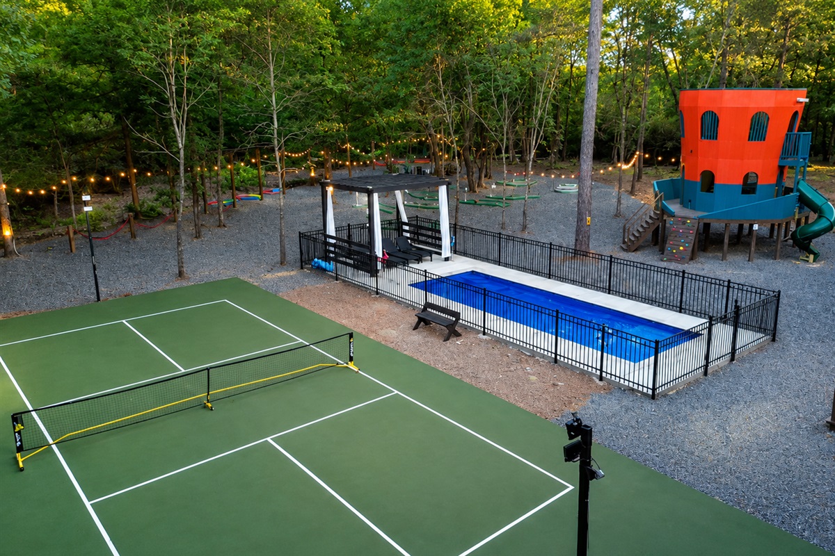 Outdoor Oasis: Enjoy tennis, swimming, and fun at your private playground in Broken Bow!