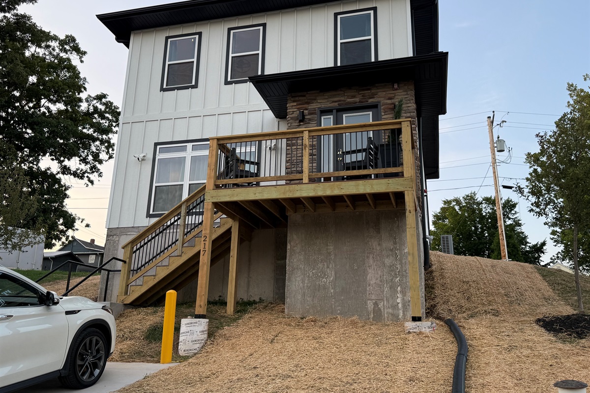 Front elevation of home with stone and board/batten siding. Home has over 2400 square feet of vacation space. This is great for family gatherings. 