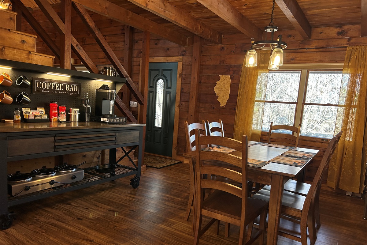 Coffee bar can double as a buffet counter. Under the counter is a 3 hole crockpot and cast iron skillet. Table will be adjusted to accommodate your group's size.