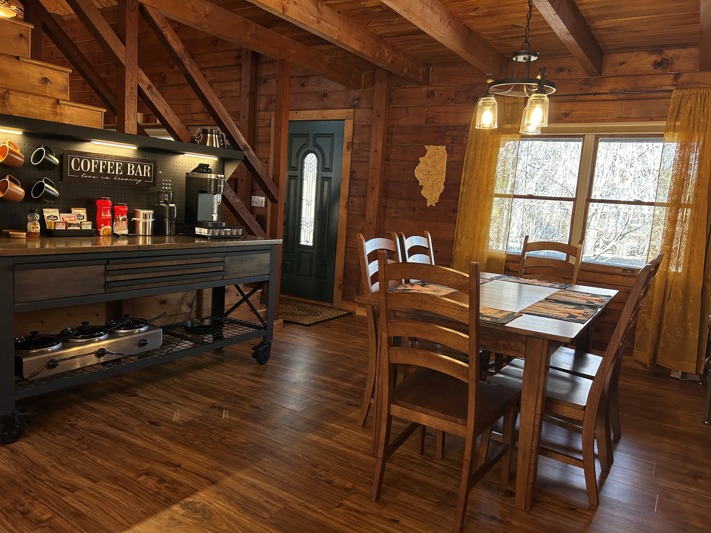 Coffee bar can double as a buffet counter. Under the counter is a 3 hole crockpot and cast iron skillet. Table will be adjusted to accommodate your group's size.