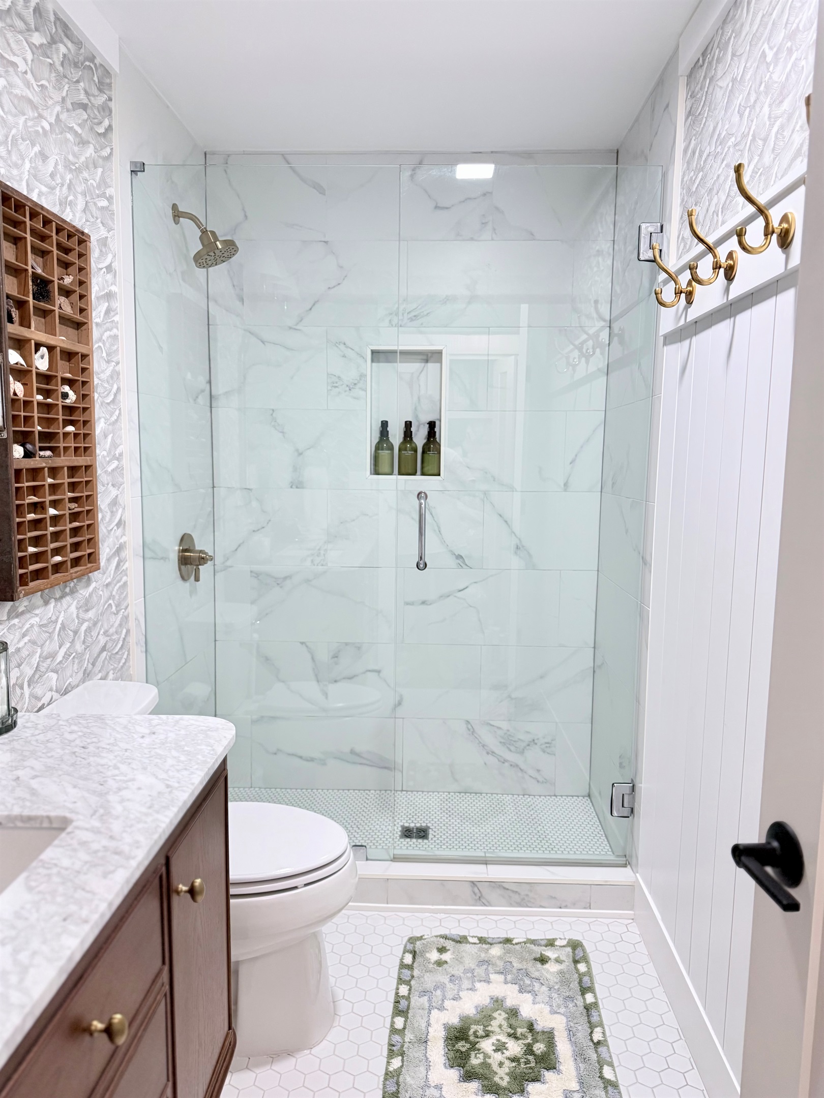 Hallway bathroom with large shower