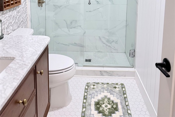 Hallway bathroom with large shower