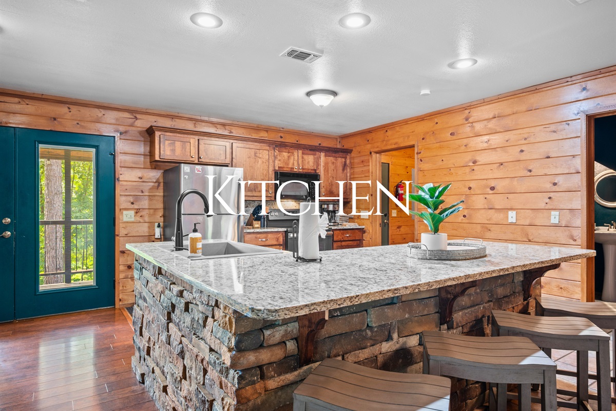 Granite countertops, island seating, and everything you need to cook like home.