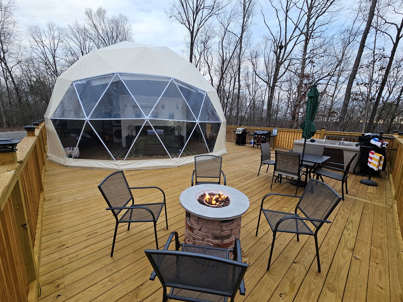 Gather by the fire, soak under the stars, and savor the forest air