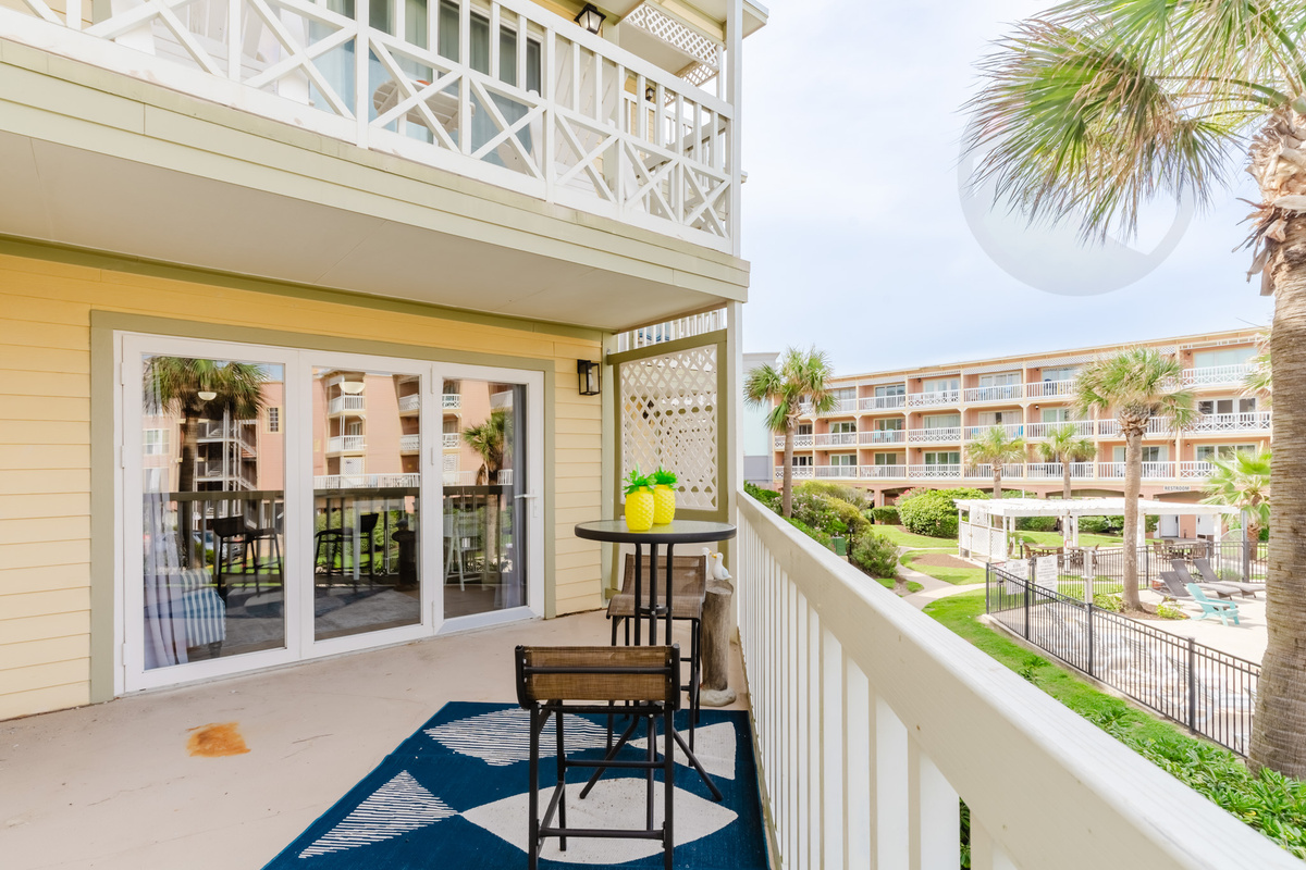 Spacious balcony, partially covered-overlooks one of 2 pools at the comples