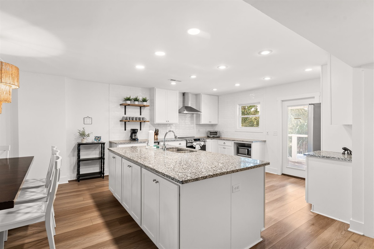 Side B: Designed as a chef’s dream, each kitchen features modern recessed lighting and ample cabinet storage