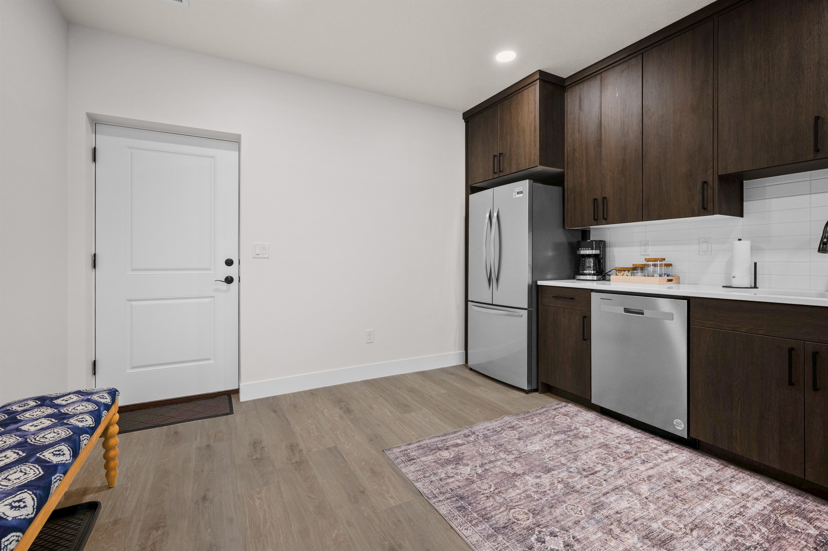 Downstairs Unit: Fully equipped kitchen ready for home-cooked meals and morning coffee.