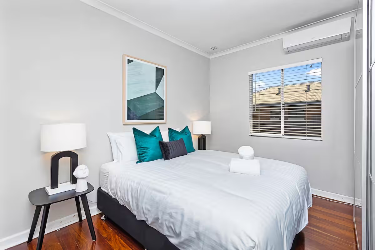 This queen bedroom gives Sasha’s Cottage on the Hill another comfortable East Victoria Park sleeping space near central Perth attractions.
