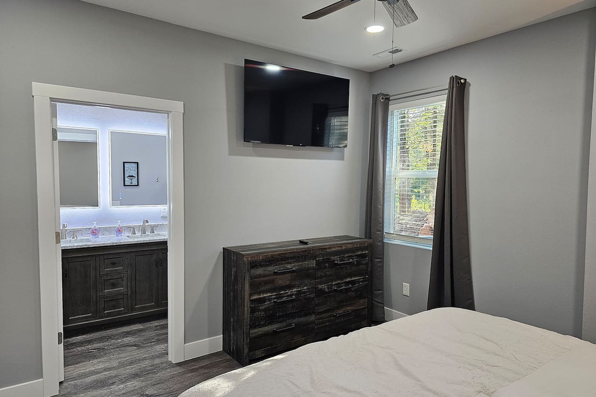 Clean, modern King suite with smart TV.