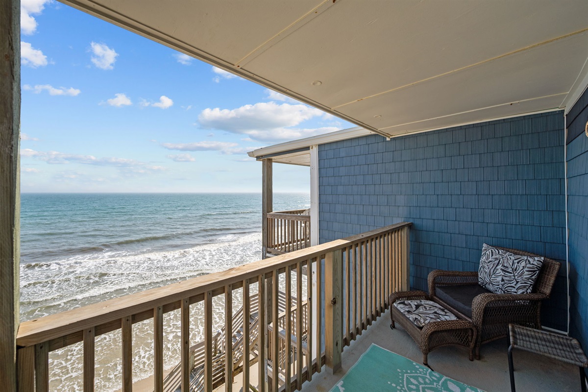 Private oceanfront balcony with seating&mdash;perfect for morning coffee and listening to the waves