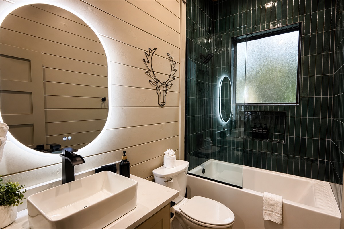 Bathroom Oasis: Enjoy a stylish retreat with elegant fixtures and vibrant tile accents!