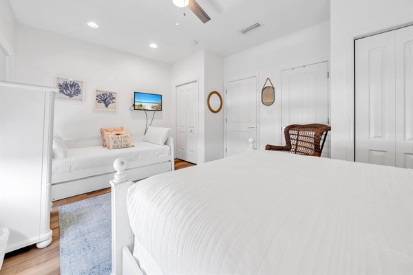 Another view of the second-floor bedroom (queen/twin/twin).  Like all rooms, this room has its own television.