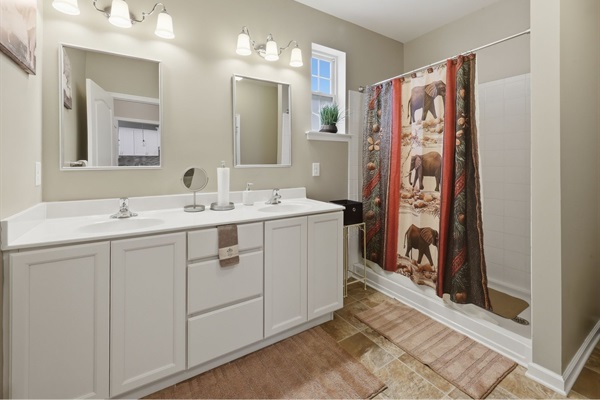 Double vanity with storage below and extra toiletries