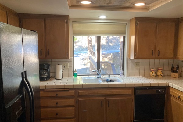 Full kitchen with dishwasher.