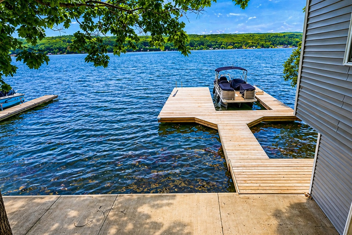 Private dock offers direct lake access and stunning water views—perfect for swimming, boating, or soaking in serene Finger Lakes sunsets. 🌅🚤🌿