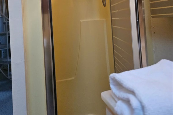 Stand up shower located in the bathroom on the second floor.