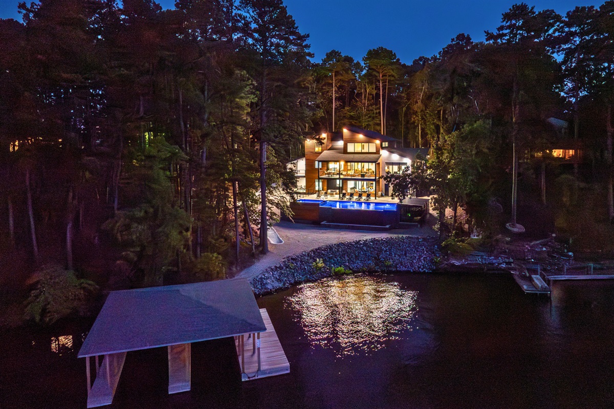 Firefly shines after dark—your private lakefront retreat glowing under the stars.