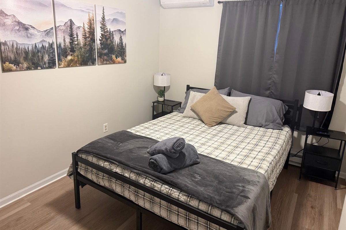Cozy up in our queen bedroom for a dreamy night's sleep