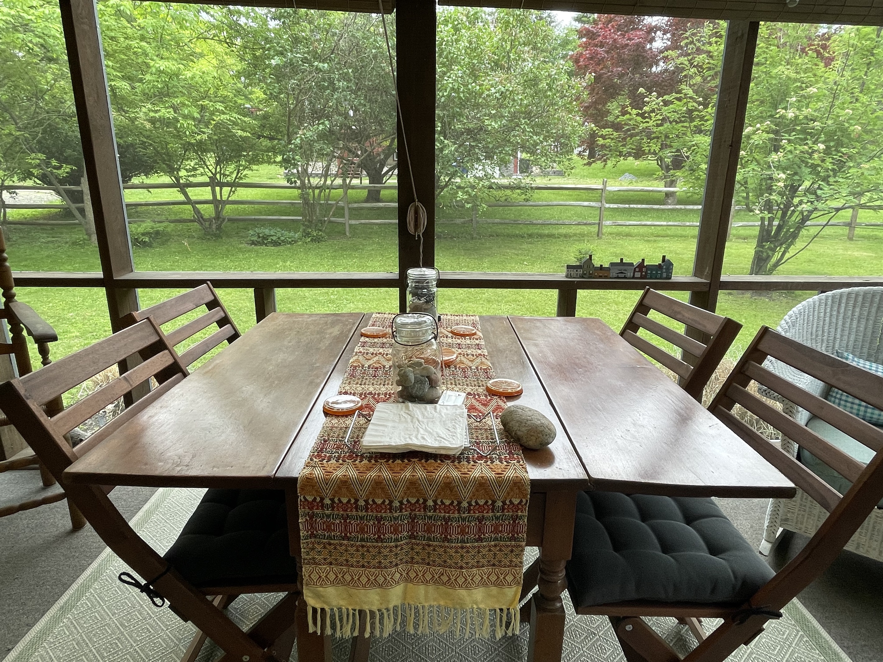 Screened in porch overlooking backyard