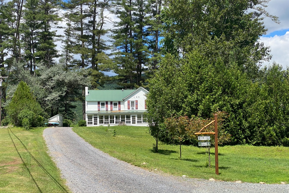 The driveway to the Farmhouse, sitting on the top of a little rise. This used to be an actual road 100 years ago.