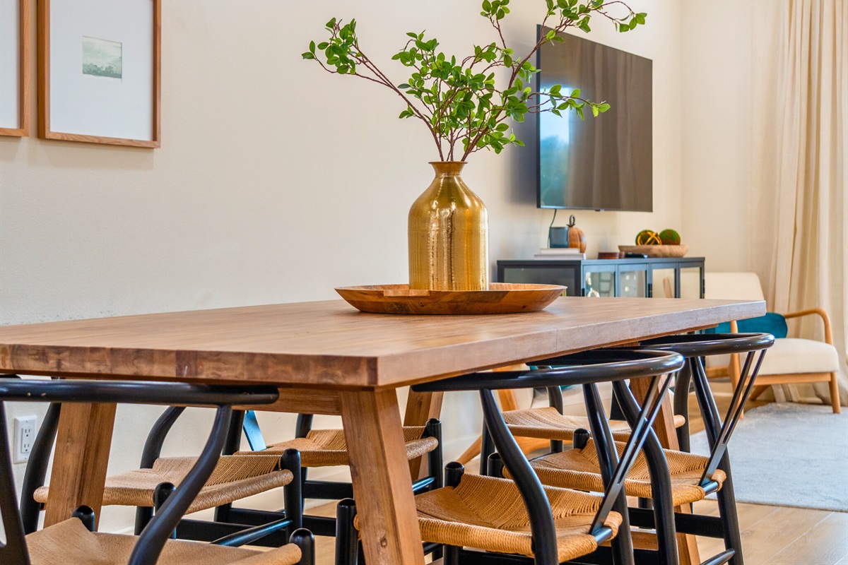 Beautifully designed dining area with a warm wood table and stylish modern chairs&mdash;ideal for shared meals and conversation.