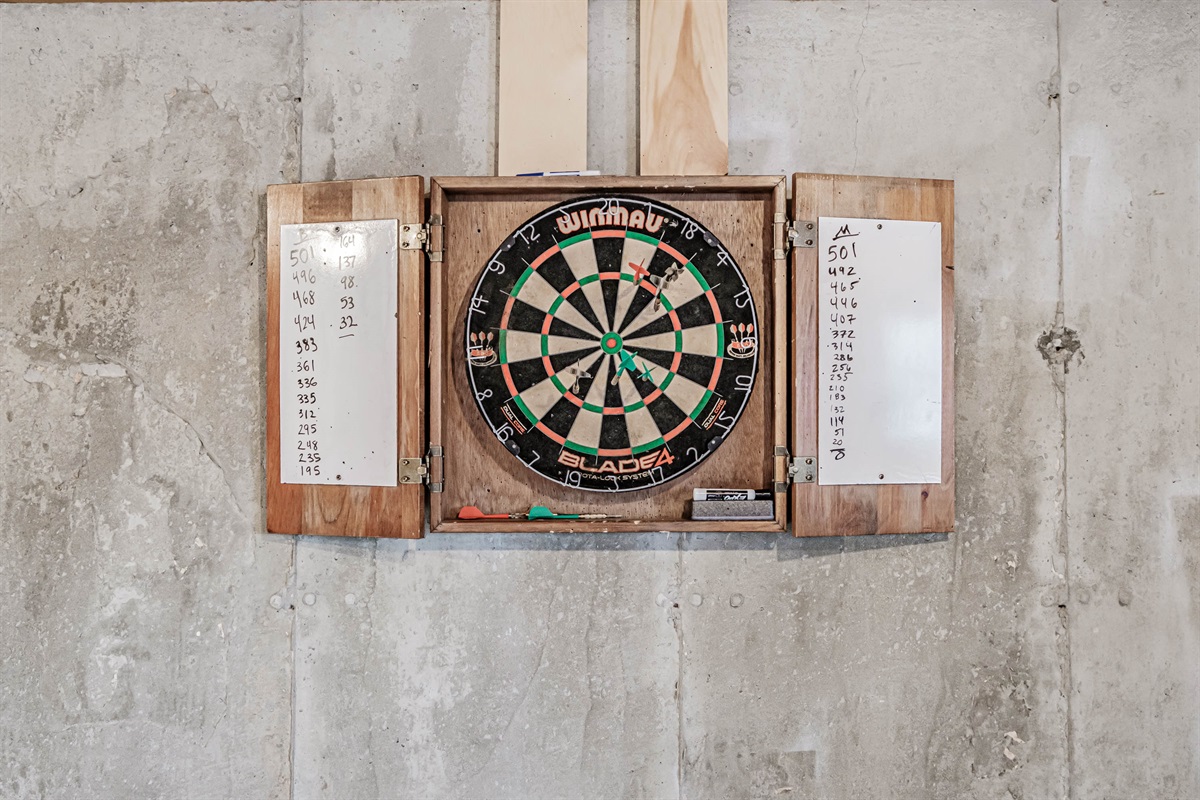 The basement game area is stocked with ping pong and darts for nonstop fun.