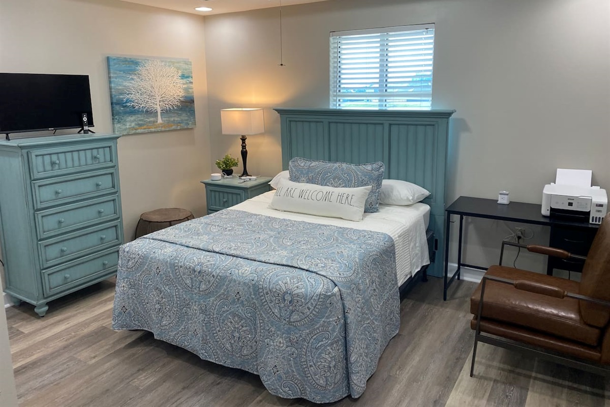 Queen bedroom includes a small desk, WiFi printer and a charging block to recharge devices or provide extra power ports. Charging cable offers dongle to fit multiple charging ports. 