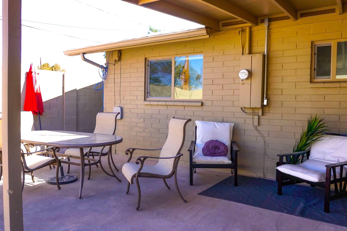 There is multiple seating option on the back patio for everyone to relax.