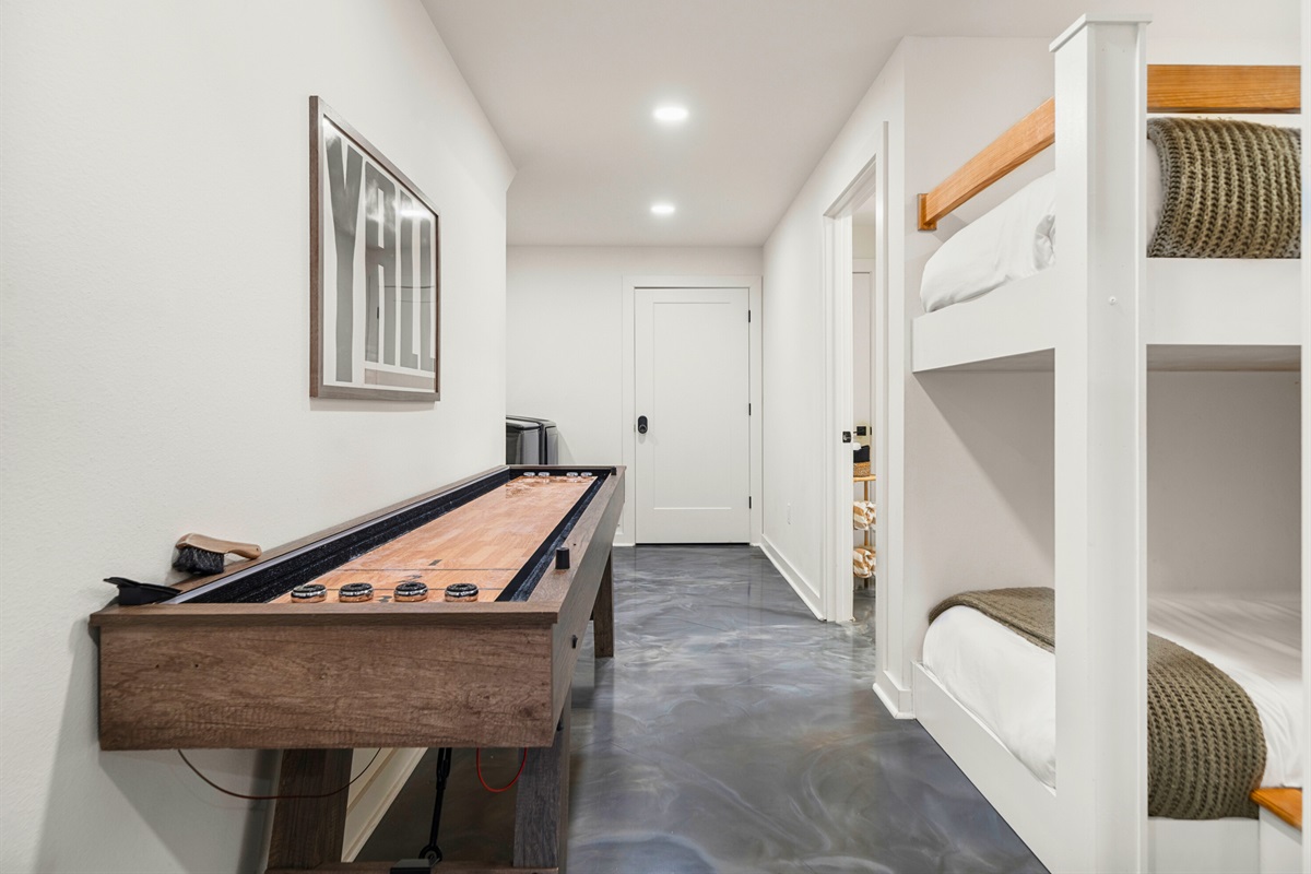 Game area with shuffleboard for a little friendly competition.