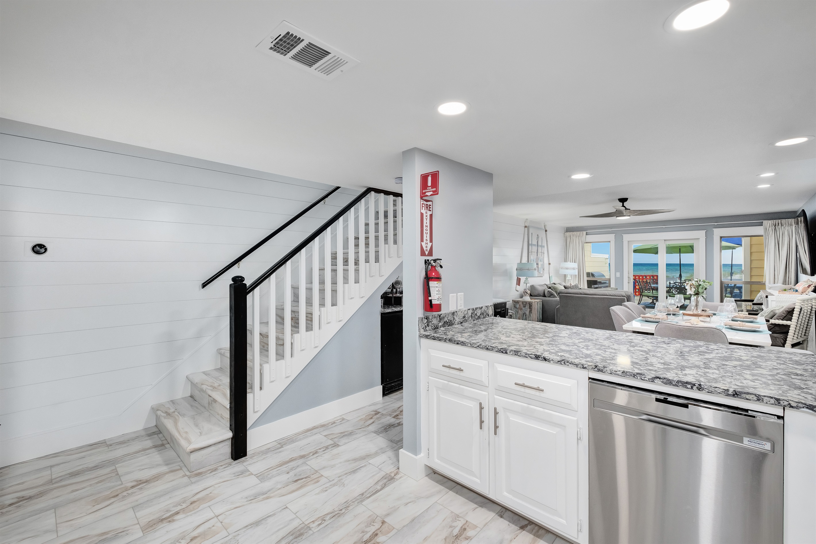 Enjoy the seamless flow of this open-concept living space that connects the kitchen, dining, and living areas. Featuring modern decor, ample natural light, and breathtaking ocean views right from your doorstep.