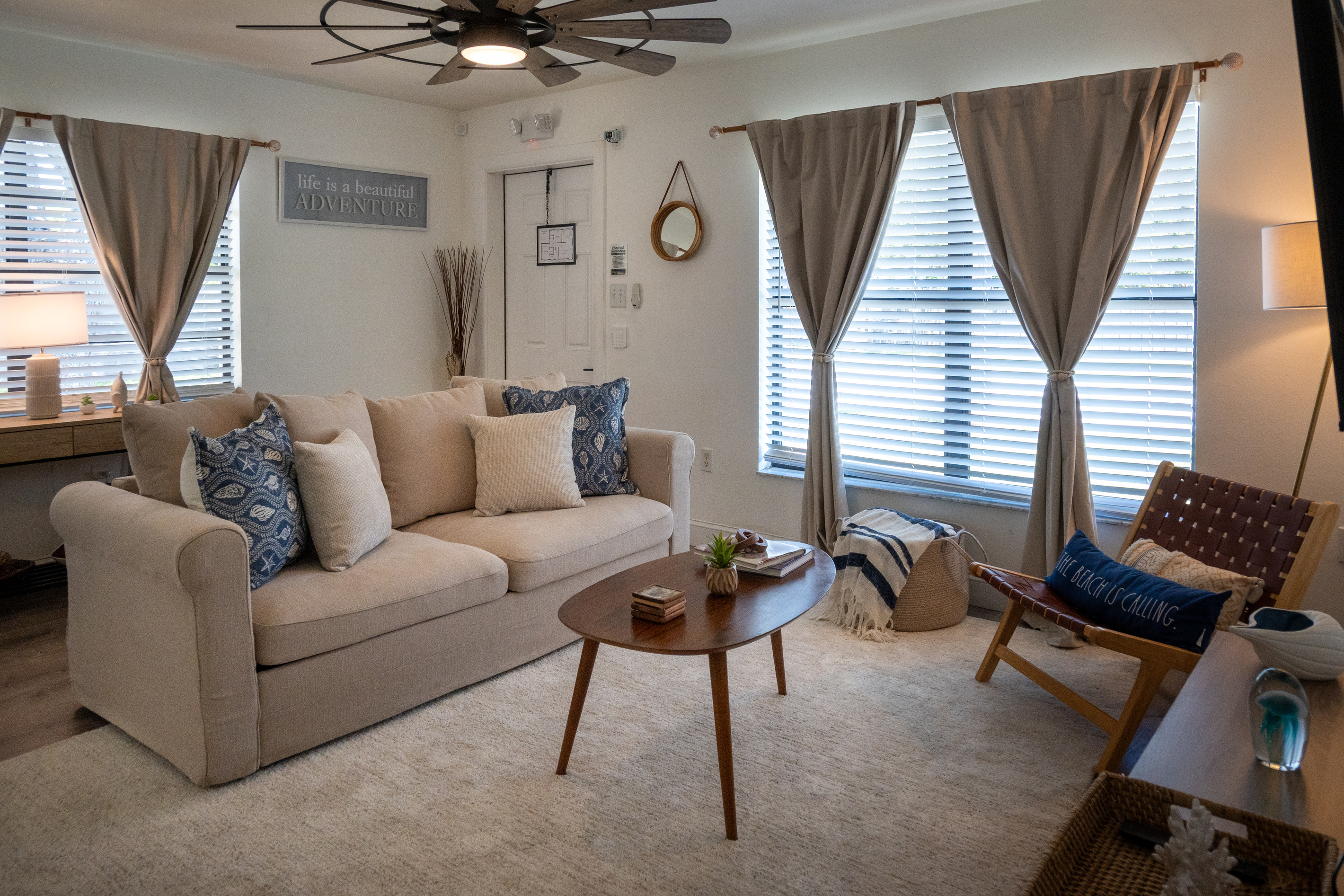 Deep, comfy sofas (one a sleeper for guests five and six) under the ceiling fan
