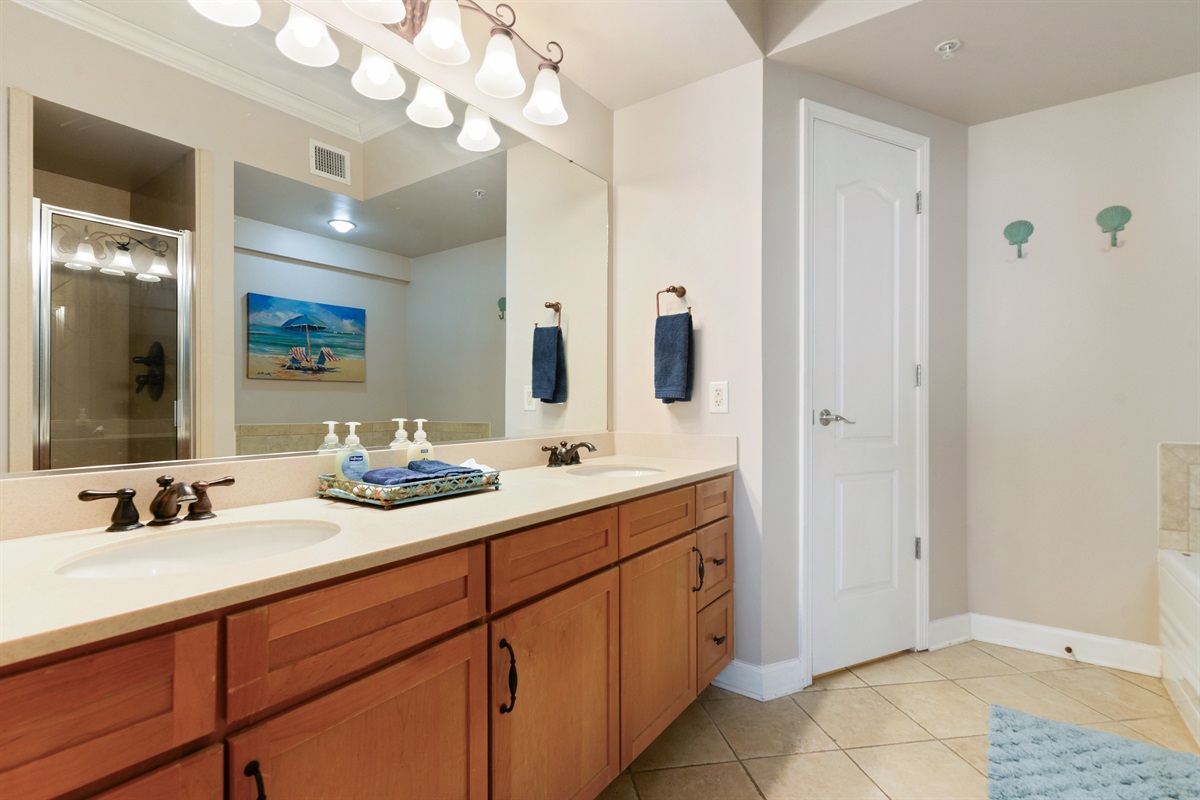 Primary berdoom en-suite bathroom features walk in shower, tub, dual vanity, separate water closet.