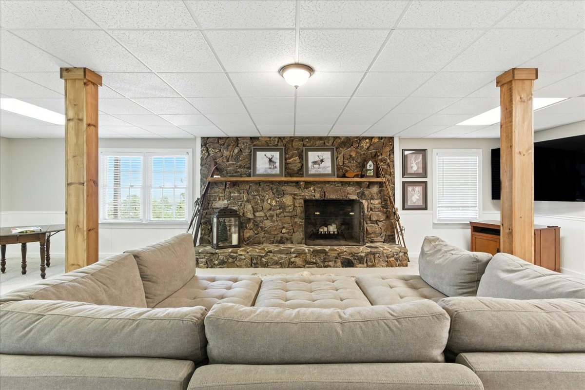 The basement has a large fireplace that adds to its cozy charm.