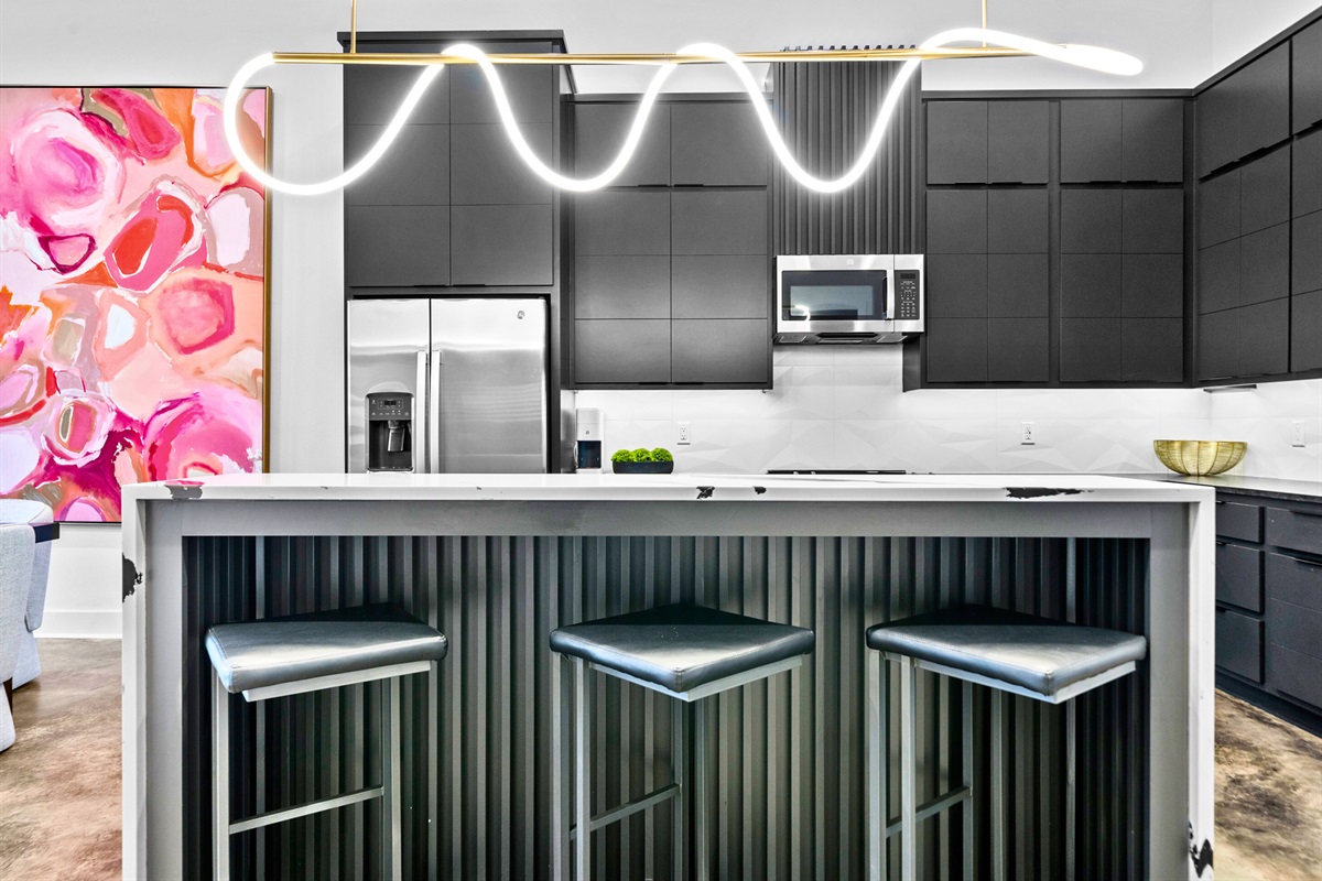 A chef&rsquo;s dream kitchen with high-end appliances, clean lines, and a welcoming island that effortlessly blends form and function.