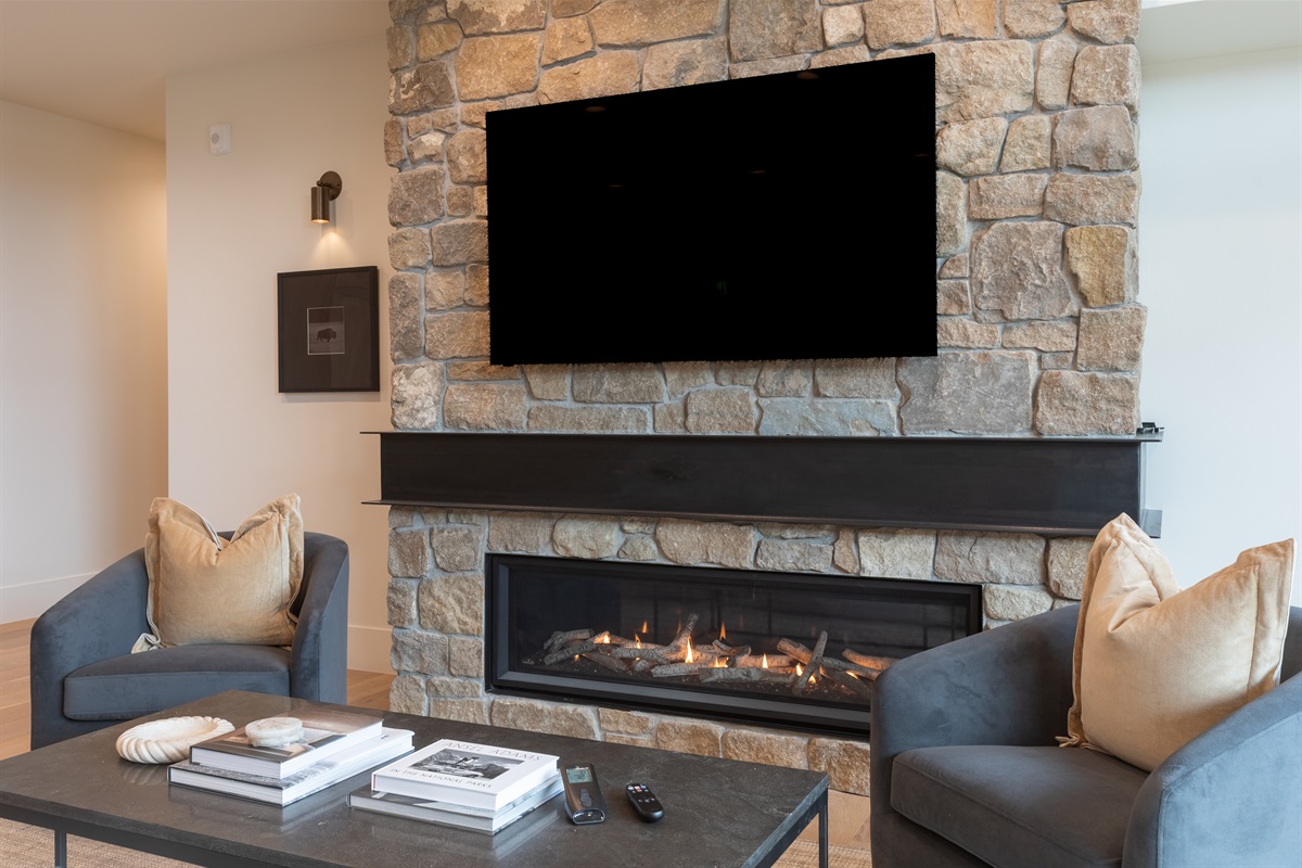 Middle Teton - Cozy up by the stone fireplace and enjoy a movie night on the large smart TV.