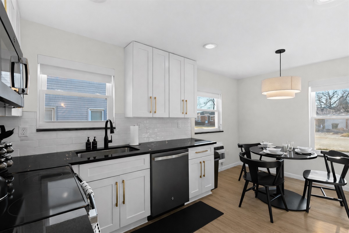 Bright, open kitchen and dining area with modern appliances, sleek finishes, and plenty of natural light—perfect for cooking, dining, and entertaining.