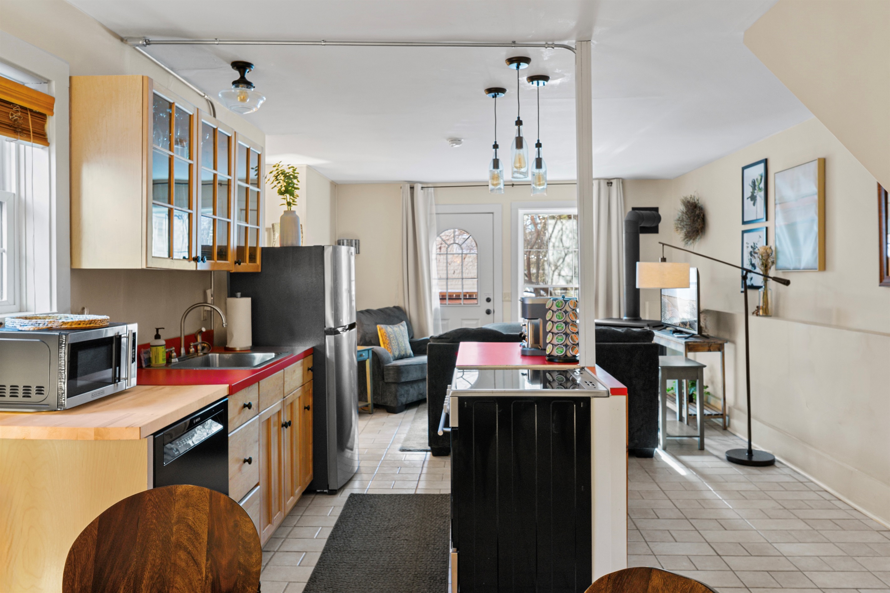 The open concept main level seamlessly connects the living space to the kitchen and dining area.