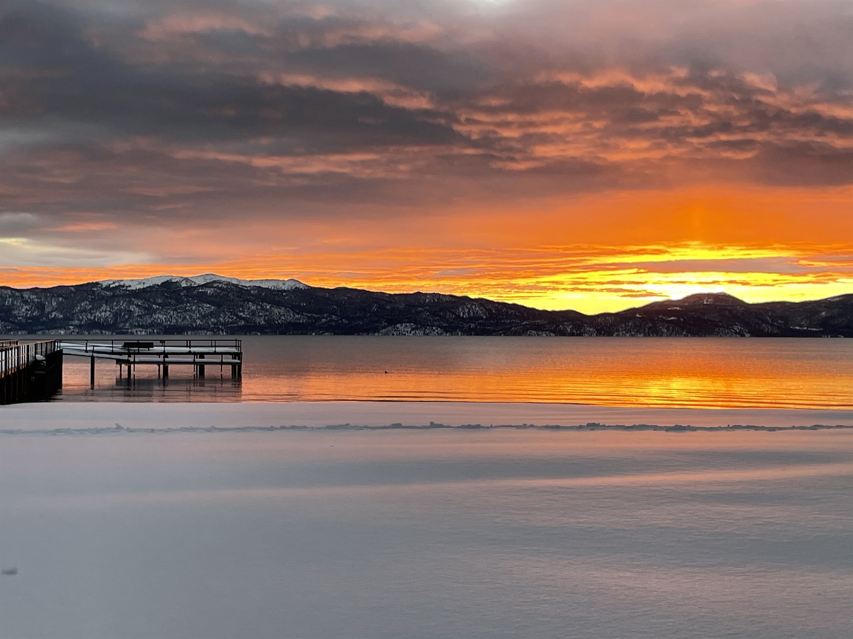 View of Lake Tahoe and our pier at sunrise in February