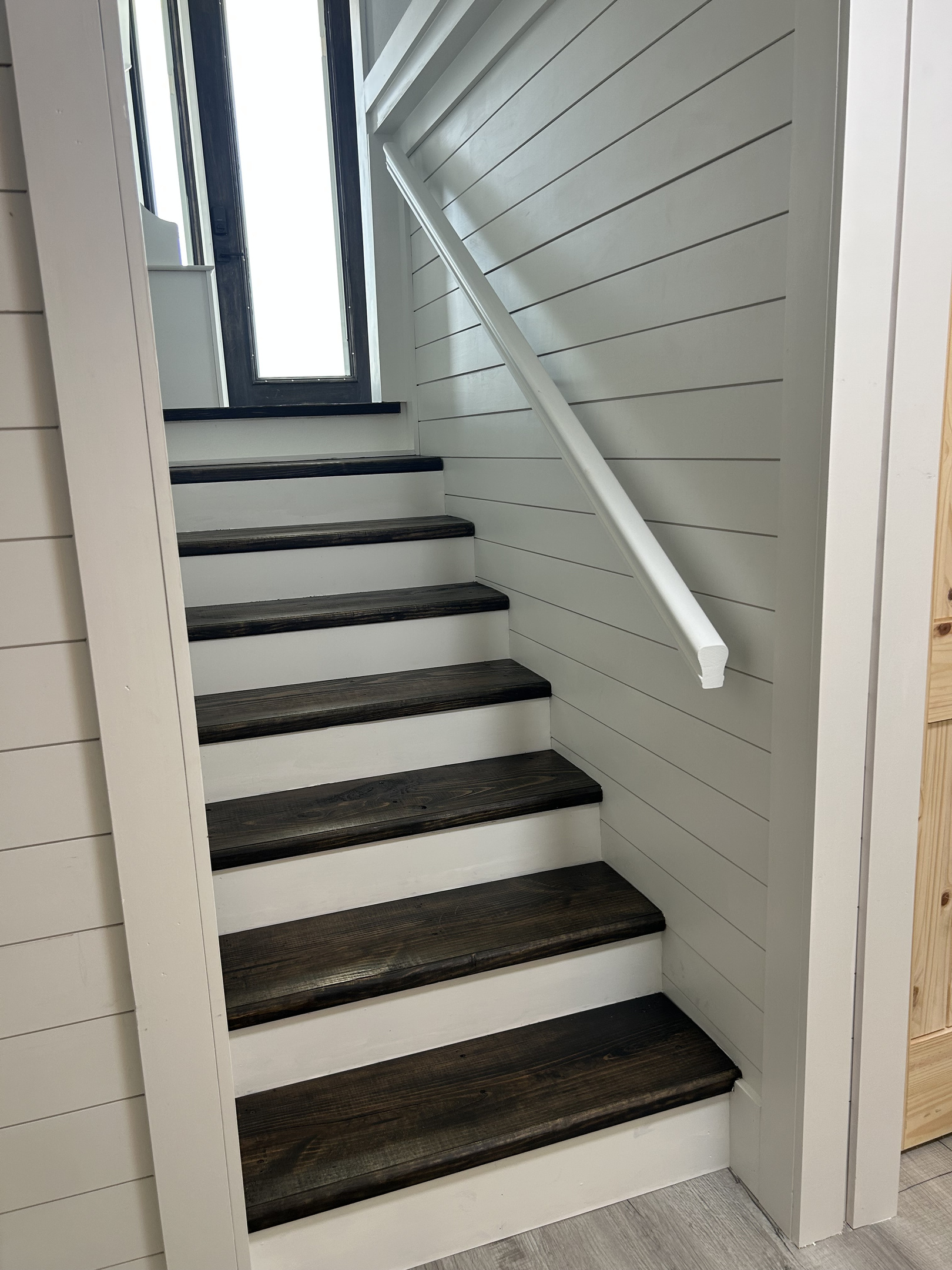 Steps to 1st floor from ground level, also there is a separate entrance from garage and bottom East side of house