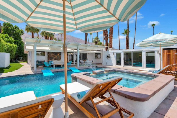 Private secluded pool with views of mountains, sky and palm trees