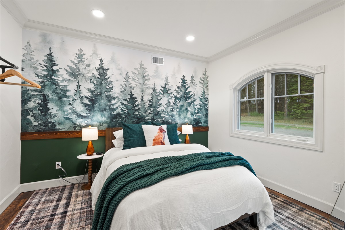 Bedroom #2 on the main level. Queen bed.