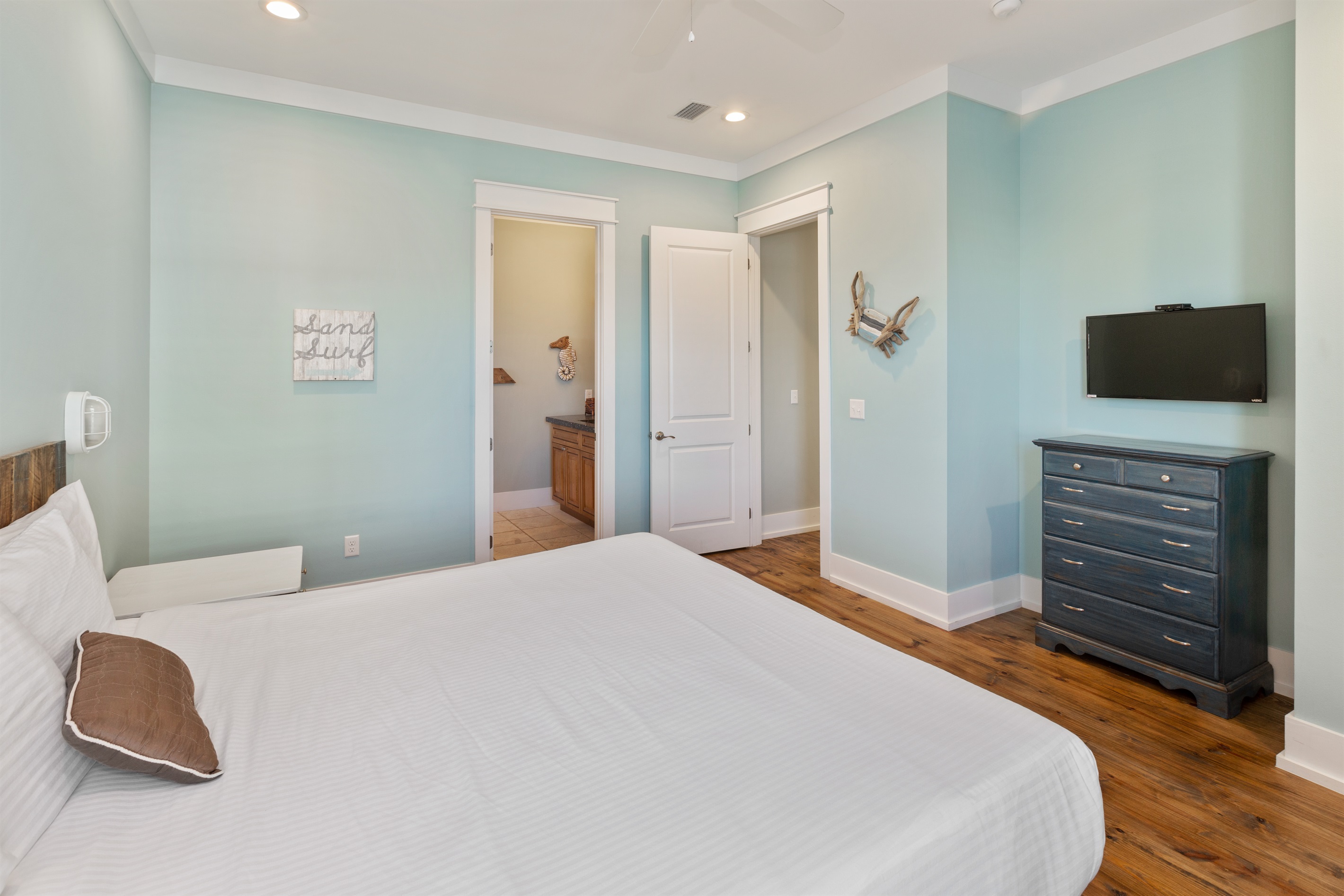 Additional second floor king suite with private bath, known as the Whale room has a large walk-in closet and views of the pool.