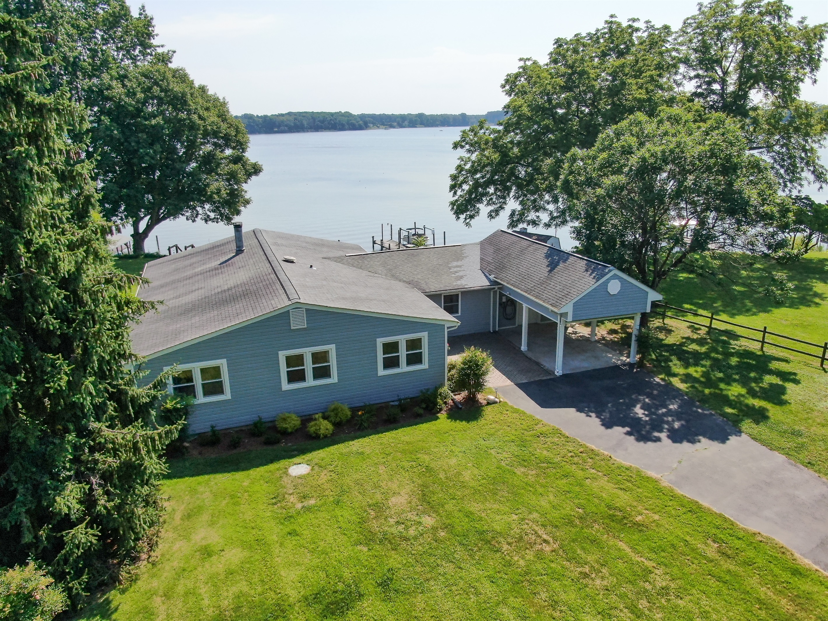 Gorgeous wide-open water views and single floor living where you can breathe out in the country.