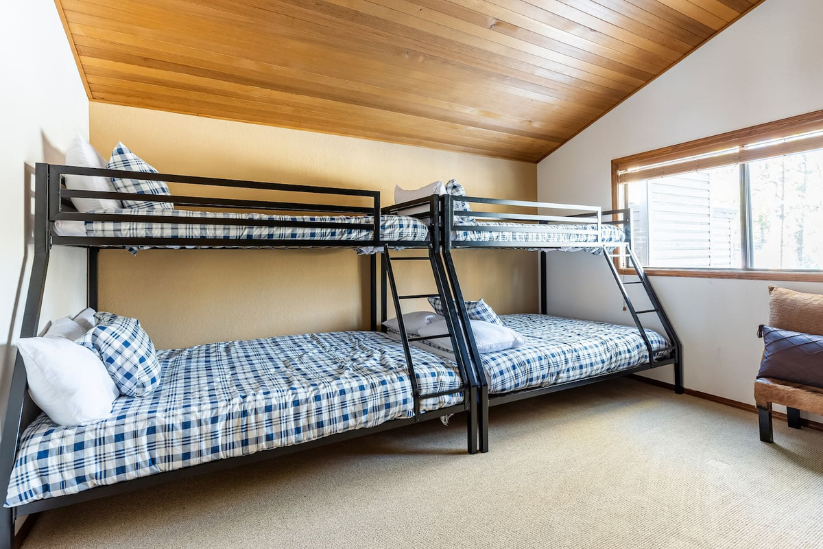 The "Owl's Nest" aka the bunk room (also upstairs) features two twin-over-full bunk beds and has plenty of space for the kids' slumber party. It also features another 75" TV with Chromecast, a blu-ray player, and a Wii U with games.