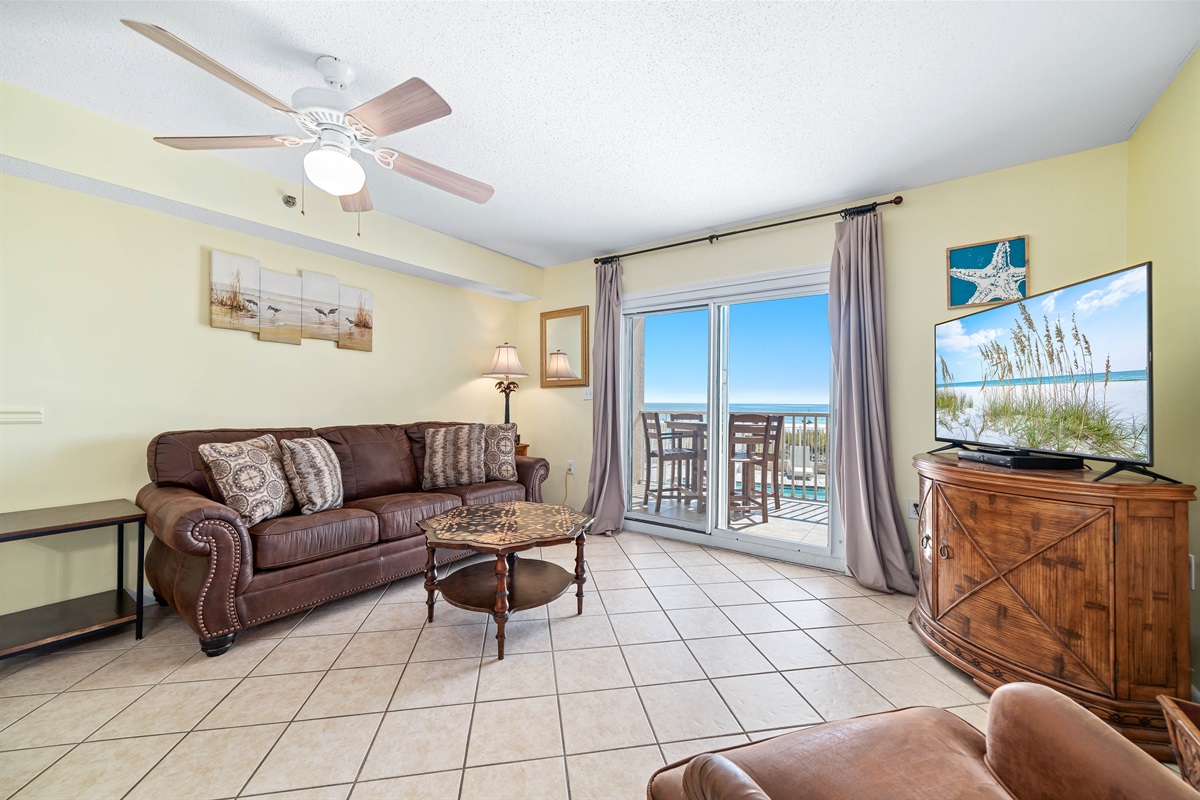 Maximize your comfort and sleeping arrangements with our versatile living area, showcasing a convenient sleeper sofa. Enjoy stunning panoramic ocean vistas right from your accommodation.